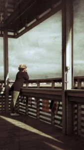 femme chapeau balustrade